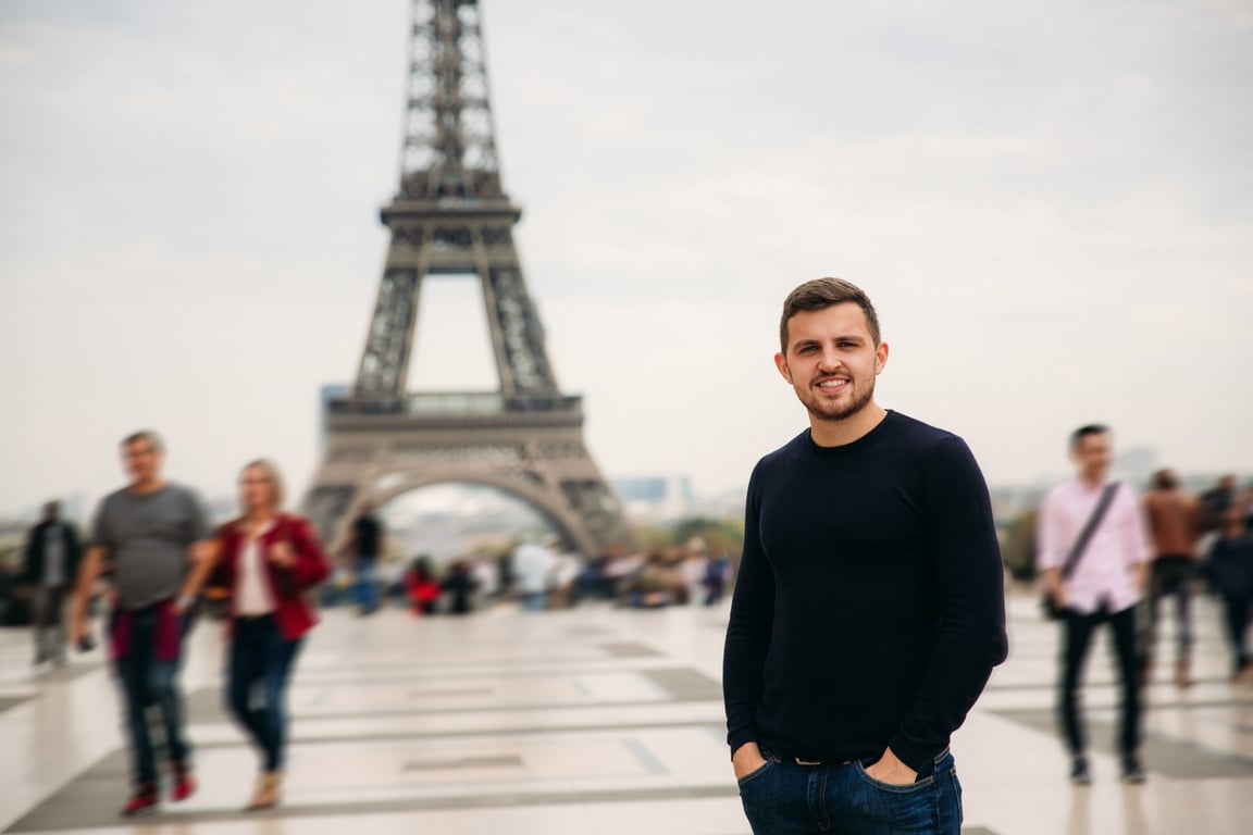 Man Standing with the Background of the Eiffel Tower